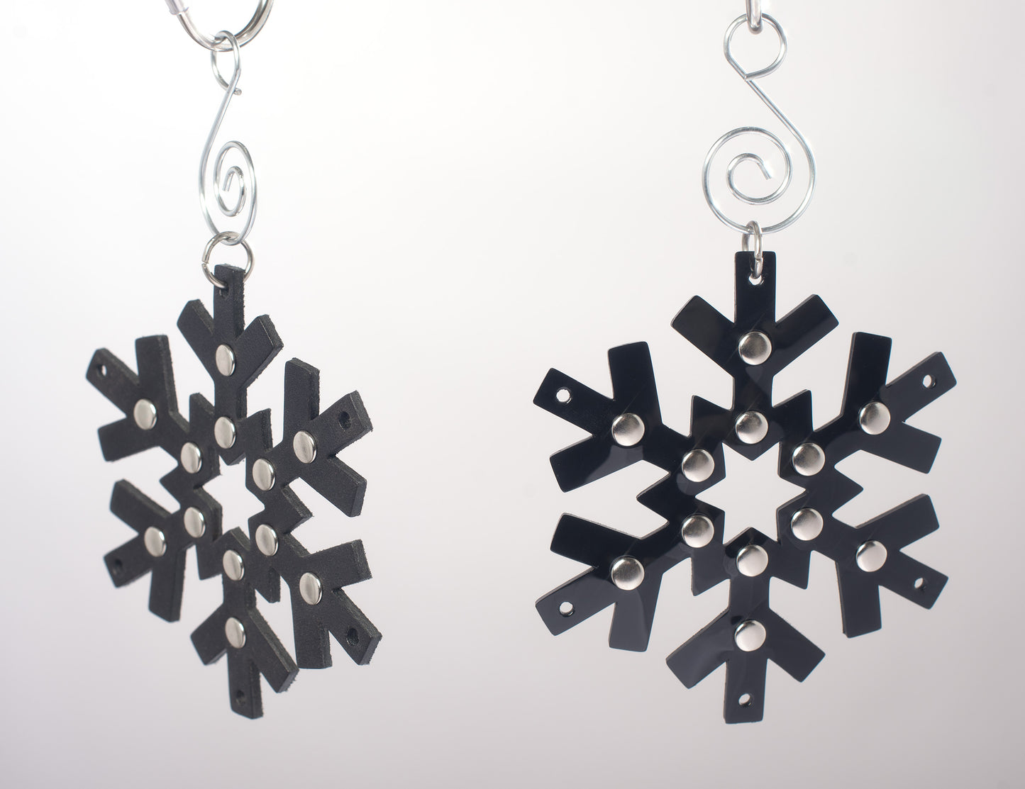 Gothic black pvc and black leather snowflake shaped ornaments with silver studded details.