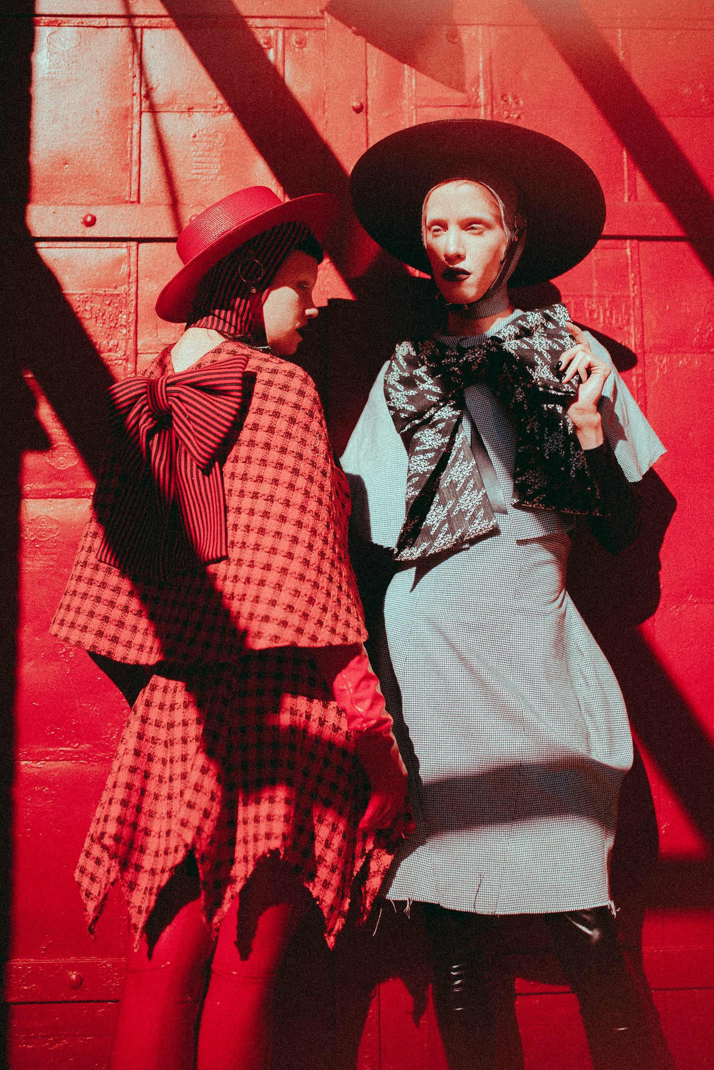 Red Apatico harness hat, red and black houndstooth fashion by Samantha Rei, photography by Emma Wondra, editorial inspired by Alexander McQueen.